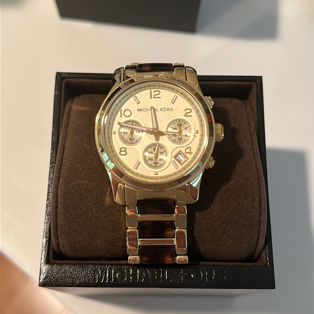 Michael Kor’s tortoise shell gold Watch